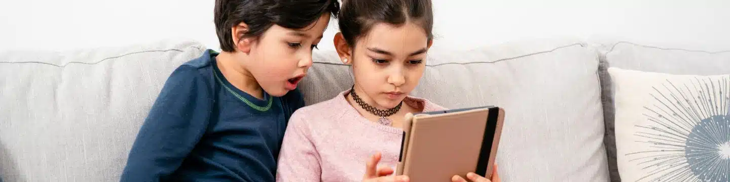 kids playing on a tablet