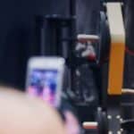 Woman taking selfie at gym