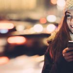 woman waiting for uber at night